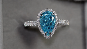 Pear cut blue diamond ring
