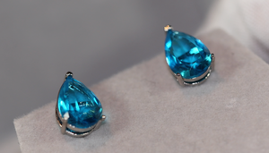 blue teardrop diamond ear studs