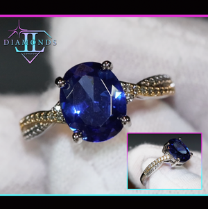 oval sapphire blue diamond engagement ring