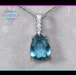 Teal blue diamond pendant