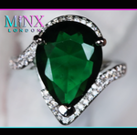 Emerald green engagement ring